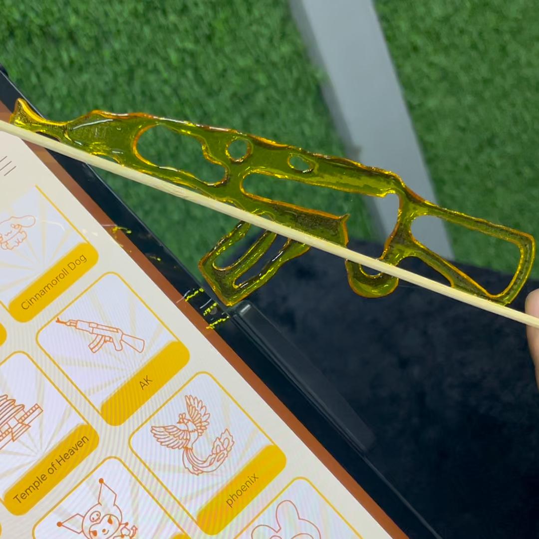 Guests using the AI Sugar Painting Robot in UAE, watching it create edible art and enjoying unique designs at events, kids activities, and parties.